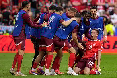 Switzerland's players celebrate scoring their side's second goal